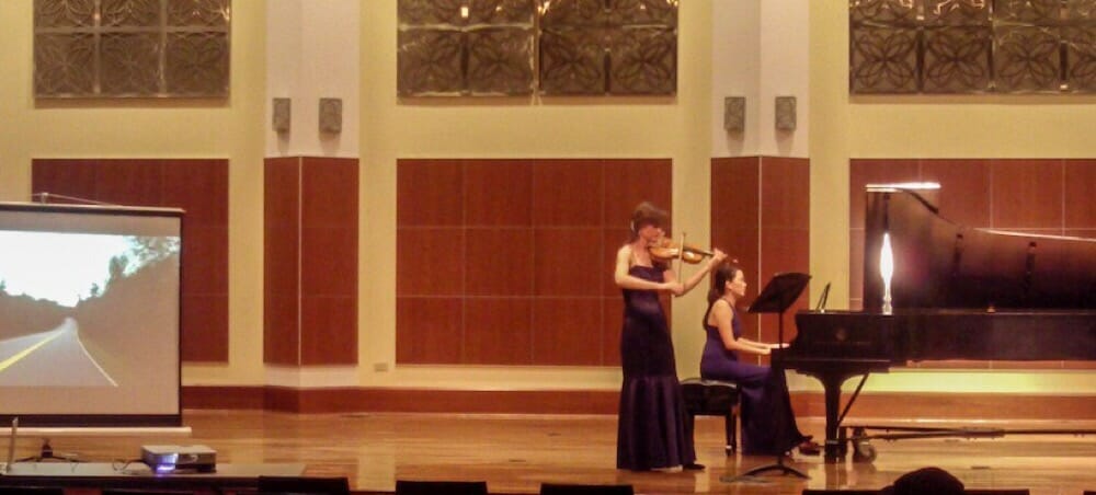 November, 2015, Louise Chan and Kate Carter performing John Adams’ Road Movies with accompanying video by Chicago-based videographer Ryan Kolegas. At Gottlieb Hall in the Merit School of Music, part of Chicago Artists Month